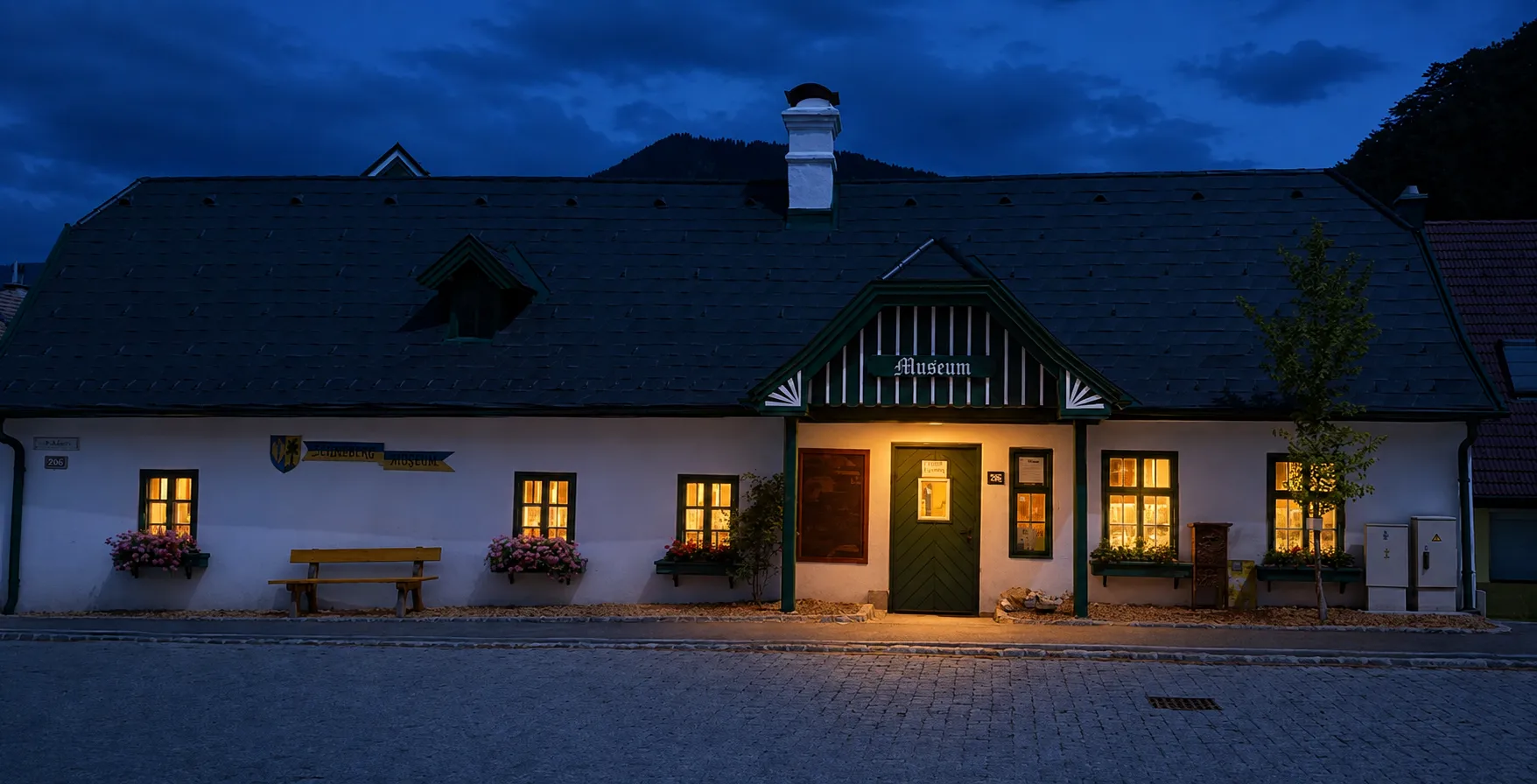 AI-edited nighttime view of the Schneeberg Museum with warmly lit windows and entrance
